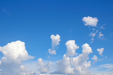 Blue sky background with cloudsの写真素材