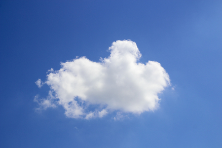 Blue sky background with cloudsの写真素材