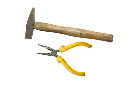 old Hammer and needle-nose pliers on a white backgroundの写真素材