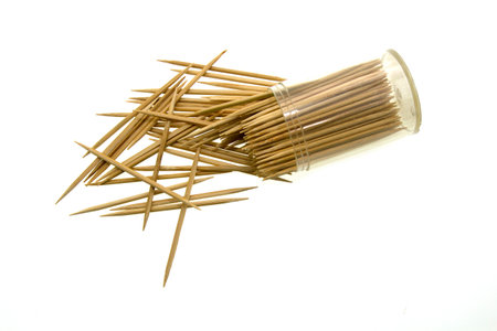 Wooden toothpicks in the plastic jar, isolated on white background.の写真素材