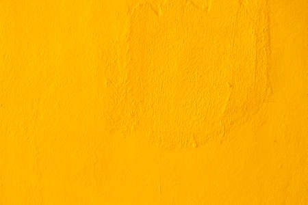 Abstract yellow cement wall texture and backgroundの写真素材