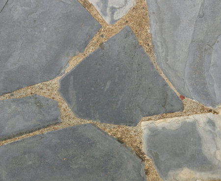 Stone walls or walkways made of black stone.