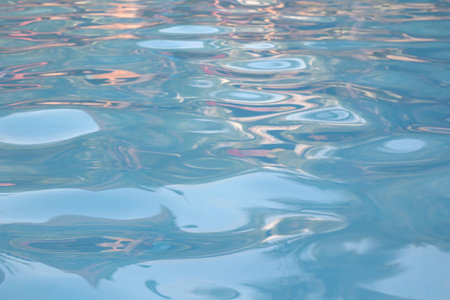 Blue and bright water surface and ripple wave in swimming pool