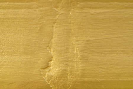 Shiny yellow leaf gold foil texture backgroundの写真素材