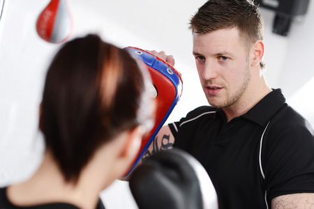 Working out with mitts or gloves and padsの写真素材