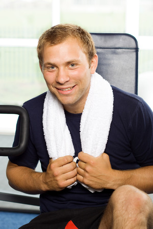 Handsome young man working out at the gymの写真素材