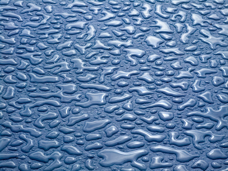 Water on the floor creates textureの写真素材