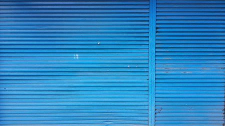 old blue rolling steel doorの写真素材