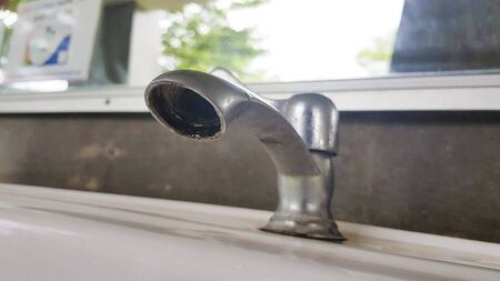 old closeup silver water tapの写真素材
