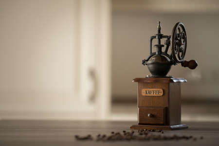 Coffee grinder with coffee beans in the kitchenの写真素材
