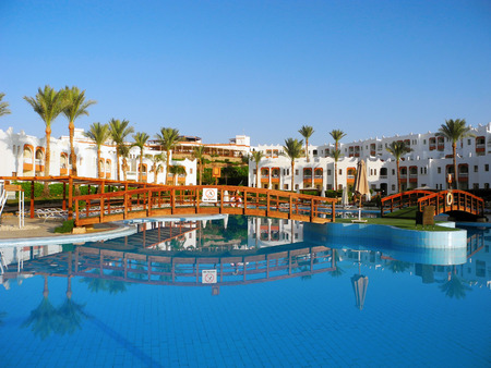 Sharm El Sheikh, Egypt - August 25, 2016: Swimming pool and palm trees at the resort in Sharm El Sheikh.のeditorial素材
