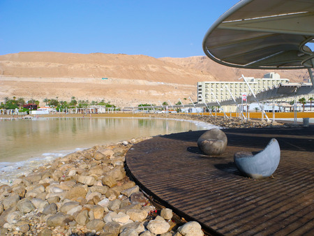 Ein Bokek, Israel - August 23, 2016: Chairs on the public beach of Dead Sea resort.のeditorial素材