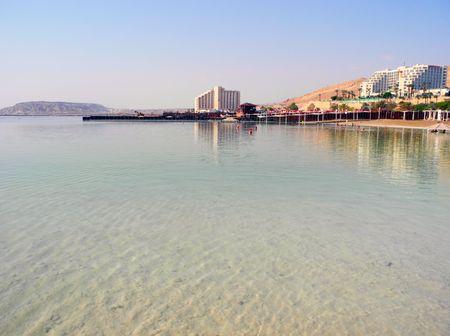 Ein Bokek, Israel - August 23, 2016: Vacationers on the beach of the Dead Sea resort.のeditorial素材