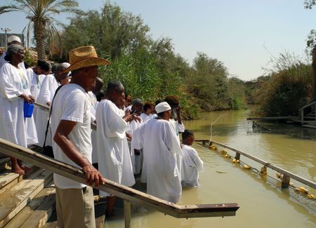 Bethabara, Israel - August 23, 2016: Pilgrims from Ethiopia are dipped into sacred water of the Jordan River.のeditorial素材