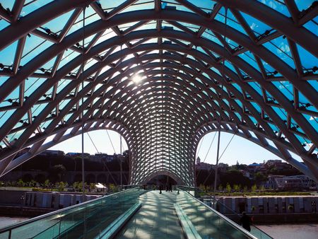 Tbilisi, Georgia - June 2, 2012: Pedestrian bridge across the Peace River Kura.Futuristic view of Bridge of Peace in Tbilisi, Georgia.のeditorial素材