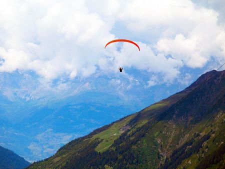 Paragliding over the highest mountains in Europe.の写真素材