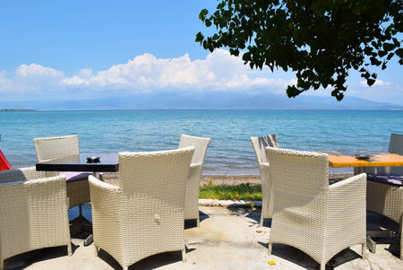 Dining tables by the sea in Kamena Vourla, Greece.のeditorial素材