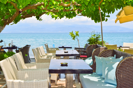Dining tables by the sea in Kamena Vourla, Greece.のeditorial素材
