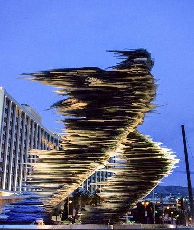 Athens, Greece - July 16, 2017: The Runner Man Glass Sculpture at Night.のeditorial素材