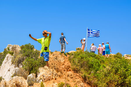 Shipwreck Bay, Zakynthos Island, Greece - July 26, 2017: Tourists on the cape photograph the Shipwreck Beach.のeditorial素材