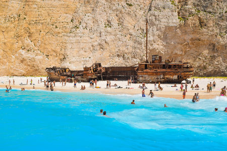 Shipwreck Bay, Zakynthos Island, Greece - July 26, 2017: Tourists on the Shipwreck Beach.のeditorial素材