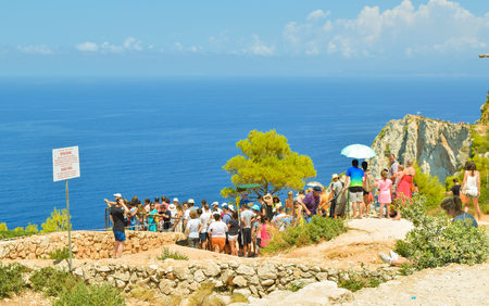 Shipwreck Bay, Zakynthos Island, Greece - July 26, 2017: The queue of tourists on the observation platform, which offers a view of Navagio beach.のeditorial素材