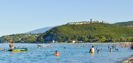 Paralia Skotinas, Greece - July 29, 2017: Vacationers on the beach on a summer sunny morning.のeditorial素材