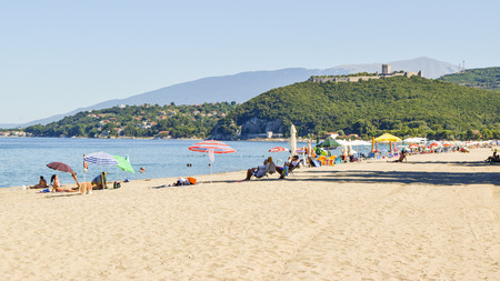 Paralia Skotinas, Greece - July 29, 2017: Vacationers on the beach on a summer sunny day.のeditorial素材