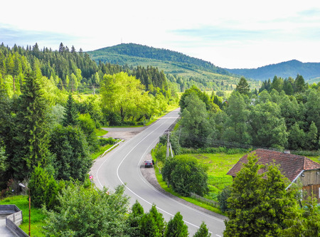 The road on a summer cloudy day, Carpathians, Ukraine.の写真素材