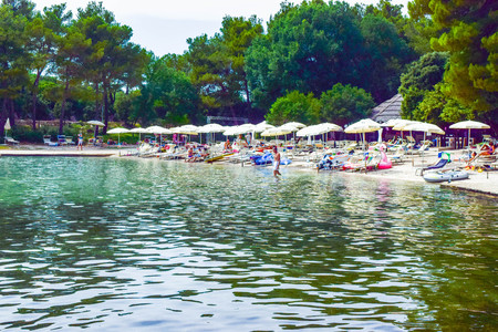 Pakostane, Croatia - July 6, 2018: Vacationers on the beach.のeditorial素材