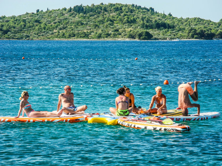 Vodice, Croatia - July 9, 2018: Group at aqua yoga classes.
The Vodice beach, Croatia.のeditorial素材