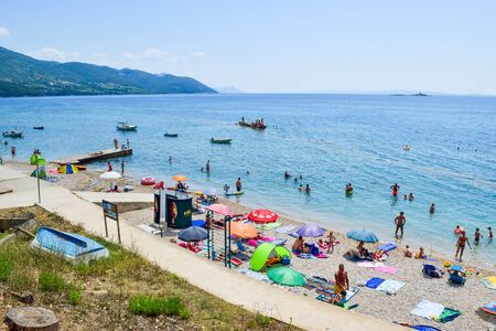 Orebic, Croatia - July 24, 2018: Vacationers on the Trstenica beautiful pebble beach.のeditorial素材