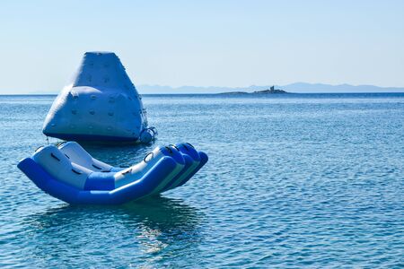Inflatable water slide on Orebic beach, Croatia.の写真素材