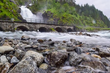 Langfossen Waterfall is located very near the E134 highway. Norway.の写真素材