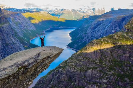 The tourists on the Trolltunga, Norway.の写真素材