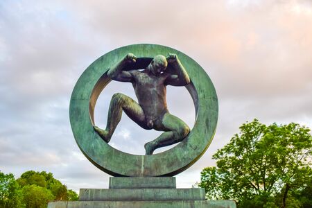 Oslo, Norway - June 16, 2019: Sculpture of a man in the ring, created by Gustav Vigeland in Frogner park.のeditorial素材
