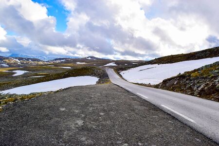 National tourist snow road Aurlandsvegen (f243) running across the mountains. Norway.の写真素材