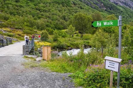 Briksdalsbreen glacier, Norway - 24 June, 2019: Walk to Briksdalsbreen (Briksdal) glacier. The melting of this glacier forms waterfall and river with clear water. Jostedalsbreen National Park. Norway.のeditorial素材