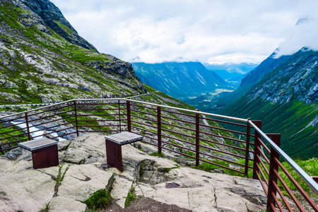 Viewpoint over Trollstigen or Troll Stairs, a serpentine mountain road that is popular tourist attraction due to its eleven hairpin bends up mountainside. More og Romsdal, Norway.の写真素材