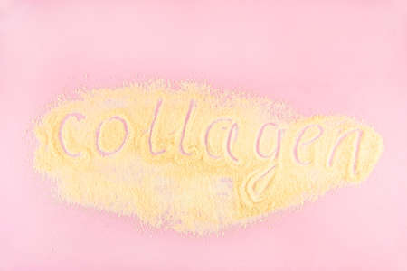 Collagen lettering made on gelatin. Gelatin is one of the main products containing collagen, essential for youthful skin and healthy joints. Light pink background. Flat lay, top view. Copy space.の写真素材