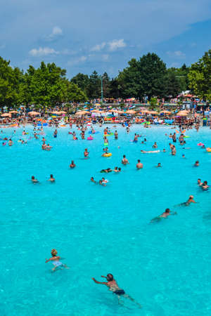 Hungary, Hajduszoboszlo - August 1, 2019: Vacationers in the entertainment pool of the thermal spa resort complex Hajduszoboszlo.のeditorial素材