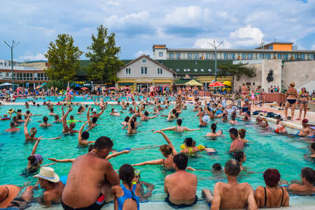 Hungary, Hajduszoboszlo - August 1, 2019: Vacationers in the entertainment pool of the thermal spa resort complex Hajduszoboszlo.のeditorial素材