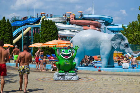 Hungary, Hajduszoboszlo - August 1, 2019: Vacationers near the water park and water slides of the thermal spa resort complex Hajduszoboszlo.のeditorial素材