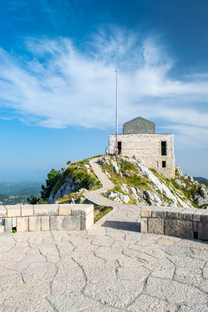 View of the mausoleum of Njegos, located on the top of Jezerski mountain in Lovcen National Park. Montenegro. Summer blue mountain landscape.の写真素材