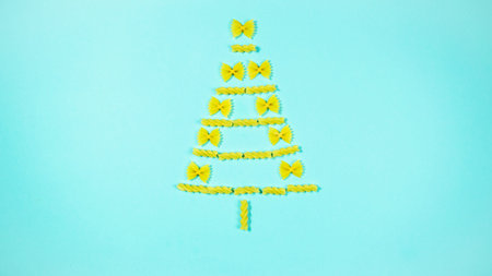 The creative installation show Christmas tree made of pasta. Concept of christmas celebration and...