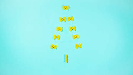The creative installation show Christmas tree made of pasta. Concept of christmas celebration and favorite food.の写真素材