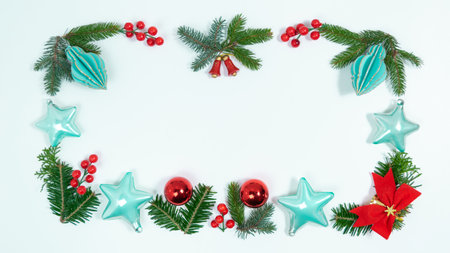 Christmas greeting card. Rectangular frame of spruce twigs, Christmas decorations and toys on white background. Template for text. copyspace.の写真素材