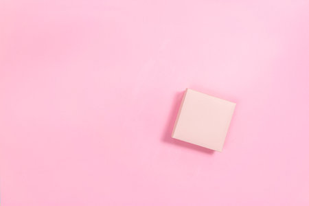Pink gift box on a pink background. Template for design or text. copyspace. flat lay.の写真素材
