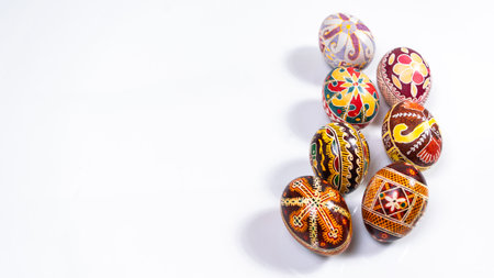 Beautiful painted tradition Ukrainian Easter Eggs (Pysanky) on a white background. greeting card. Template for design or text. copyspace.の写真素材
