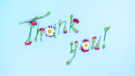 International Thank-You Day. Greeting Card. The word: Thank you made from natural flowers and buds...